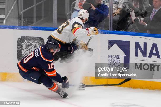 New York Islanders Right Wing Simon Holmstrom and Las Vegas Golden Knights Defenseman Alec Martinez battle for the puck during the second period of...