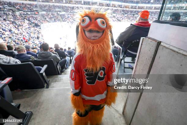 Young fan dressed as Philadelphia Flyers mascot Gritty poses during third period action between the Flyers and the Winnipeg Jets at the Canada Life...