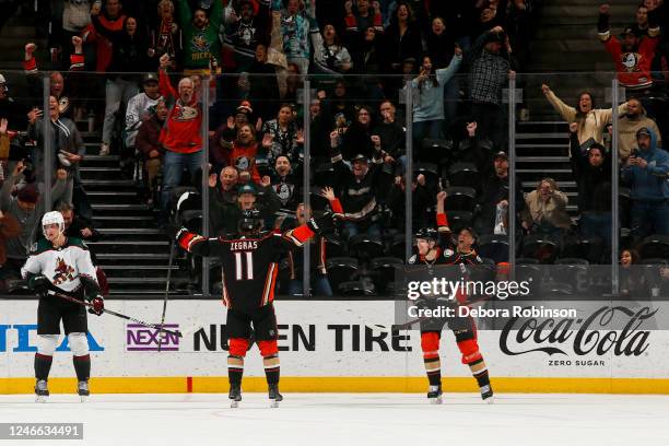 Trevor Zegras of the Anaheim Ducks celebrates his game winning goal with teammates during overtime against the Arizona Coyotes at Honda Center on...