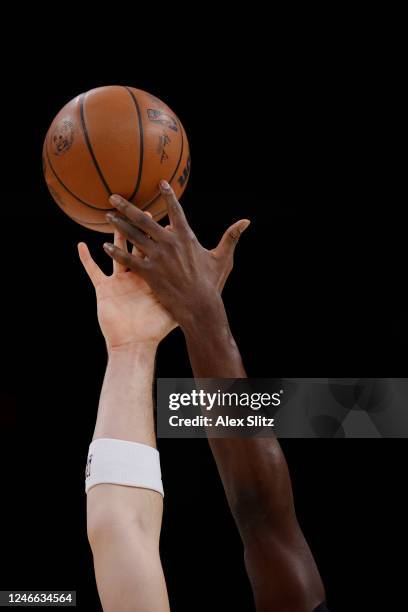 Ivica Zubac of the LA Clippers and Clint Capela of the Atlanta Hawks jump for the ball at tip-off during the first half at State Farm Arena on...