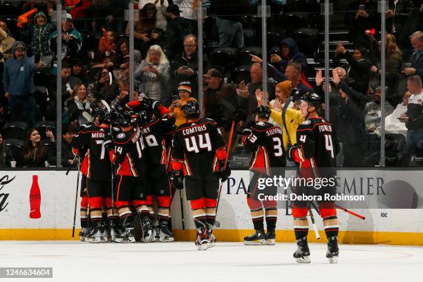 Trevor Zegras of the Anaheim Ducks celebrates his game winning goal with teammates during overtime against the Arizona Coyotes at Honda Center on...