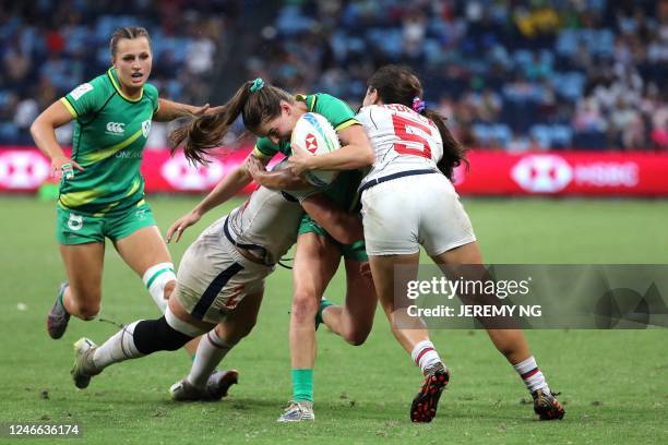 Players tachle Irleand's Kate Farrell McCabe during the World Rugby Women's Sevens series match between Ireland and the United States at the Allianz...