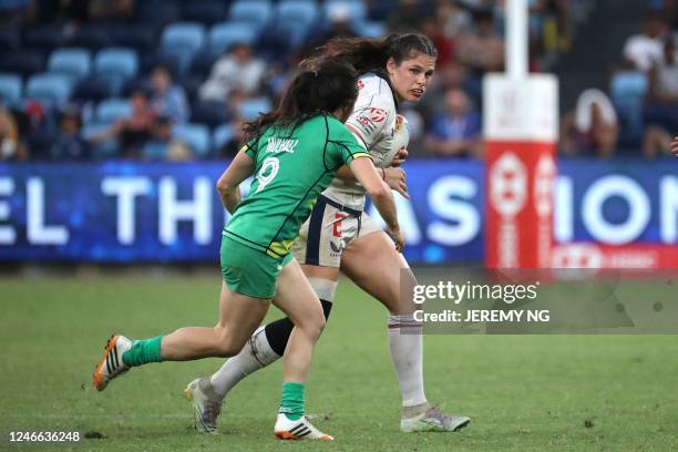 Ireland's Lucy Mulhall tackles USA's Ilona Maher during the World Rugby Women's Sevens series match between Ireland and the United States at the...