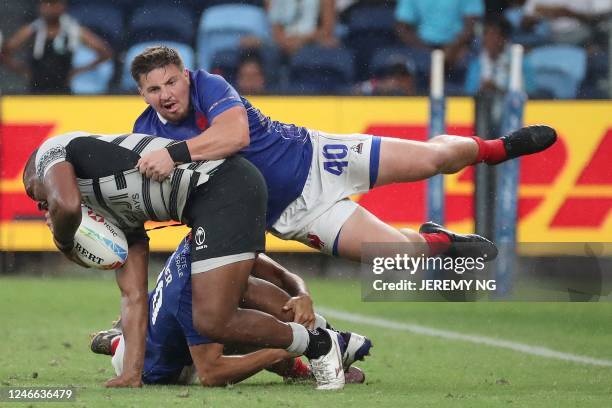 France's Laborde Dorian makes a tackle during the World Rugby Sevens series match between Fiji and France at the Allianz Stadium in Sydney on January...