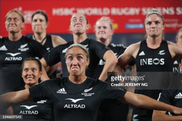 New Zealand's players pefrom the Haka as they celebrate winning the women's competition in the World Rugby Sevens series, at the Allianz Stadium in...