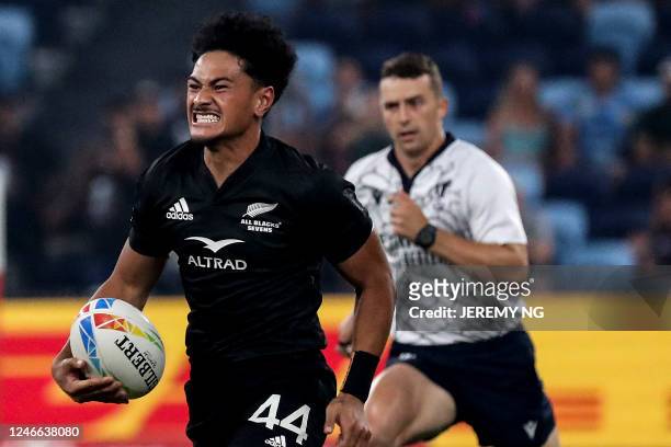 New Zealand's Roderick Solo makes a break and scores a try during the World Rugby Sevens series final match between New Zealand and South Africa at...