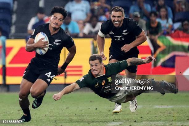 New Zealand's Roderick Solo makes a break during the World Rugby Sevens series final match between New Zealand and South Africa at the Allianz...