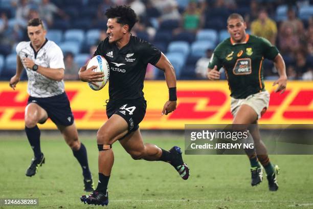 New Zealand's Roderick Solo makes a break during the World Rugby Sevens series final match between New Zealand and South Africa at the Allianz...
