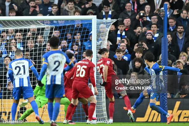 Brighton's Japanese midfielder Kaoru Mitoma scores their second goal during the English FA Cup fourth round football match between Brighton & Hove...