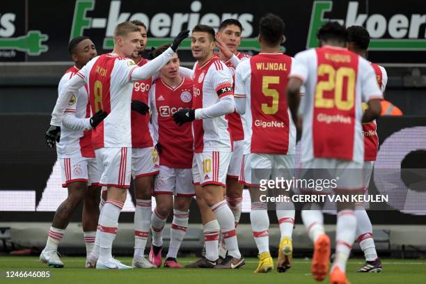 Ajax's Devyne Rensch celebrates with team mates after scoring a goal during the Dutch Eredivisie football match between SBV Excelsior and Ajax...