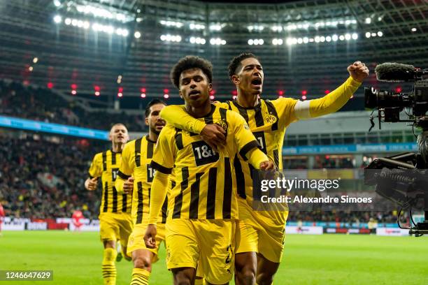 Karim Adeyemi of Borussia Dortmund is celebrating his goal with Jude Bellingham during the Bundesliga match between Bayer 04 Leverkusen and Borussia...