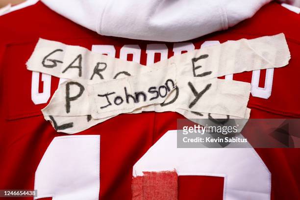 San Francisco 49ers fan wears a jersey with quarterback Josh Johnsons name taped over the names of injured quarterbacks Jimmy Garoppolo, Trey Lance,...