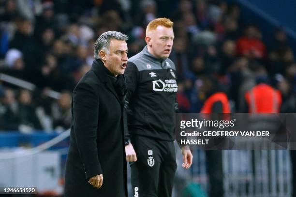 Paris Saint-Germain's French head coach Christophe Galtier and Reims' Belgian head coach William Still react on the touch line during the French L1...