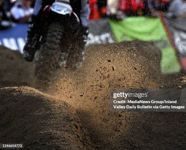 Anaheim, CA A 450SX rider kicks up sand as he rides through a section of the course during qualifying for round 4 of the AMA Supercross Championship...
