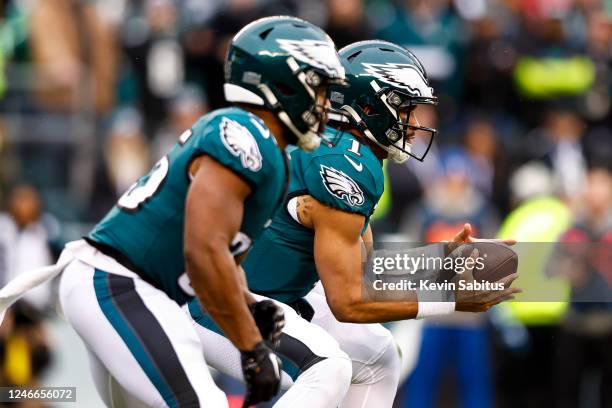 Jalen Hurts of the Philadelphia Eagles catches a snap during the first quarter of the NFC Championship NFL football game against the San Francisco...