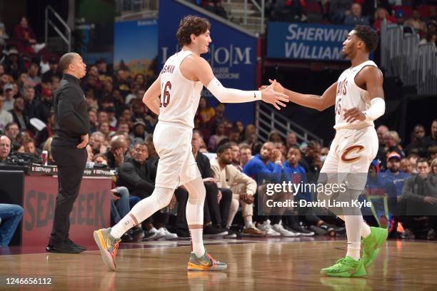 Cedi Osman of the Cleveland Cavaliers high fives Donovan Mitchell during the game against the LA Clippers on January 29, 2023 at Rocket Mortgage...