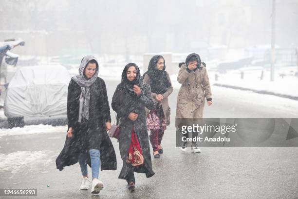 Afghan women are seen during snowfall in Kabul, Afghanistan on January 29, 2023.