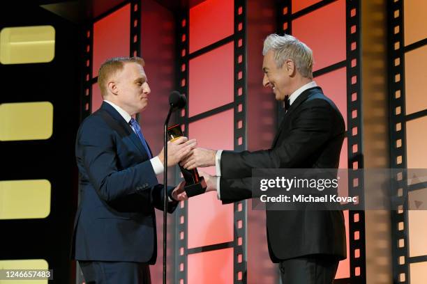 Alan Cumming presents the Best TV Series award for "The Old Man" to Jonathan E. Steinberg onstage during the AARP Annual Movies for Grownups Awards -...