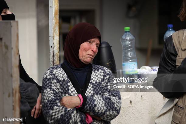 Palestinian woman cries, on the rubble of Ratib Hatab Shqeirat's house after it was destroyed by Israeli bulldozers in the Jabal Mukaber neighborhood...