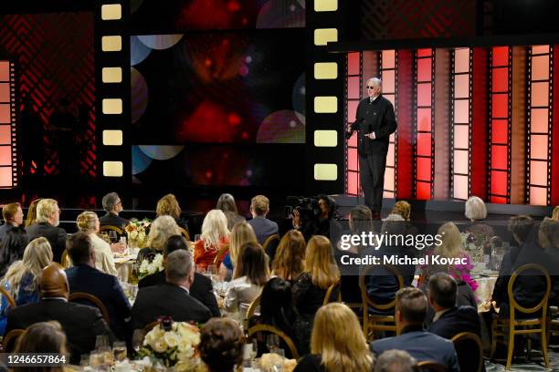 Bone Burnett presents the Best Actor TV award for "The Old Man" onstage during the AARP Annual Movies for Grownups Awards - Show at Beverly Wilshire,...