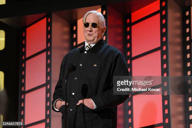 Bone Burnett presents the Best Actor TV award for "The Old Man" onstage during the AARP Annual Movies for Grownups Awards - Show at Beverly Wilshire,...