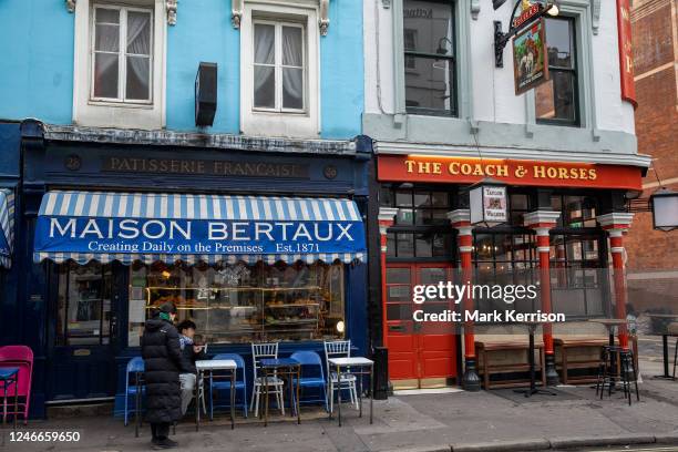 French patisserie Maison Bertaux is pictured alongside the Coach & Horses public house in Greek Street, Soho, on 26 January 2023 in London, United...