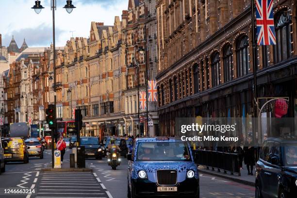 Street view on Brompton Road outside Harrods department store in Knightsbridge on 13th January 2023 in London, United Kingdom. Harrods Limited is a...