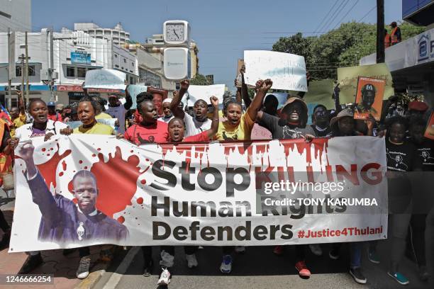 Members of various Human Rights Defender groups hold a protest against the brutal killing of renowned human rights lawyer, Thulani Maseko at his home...