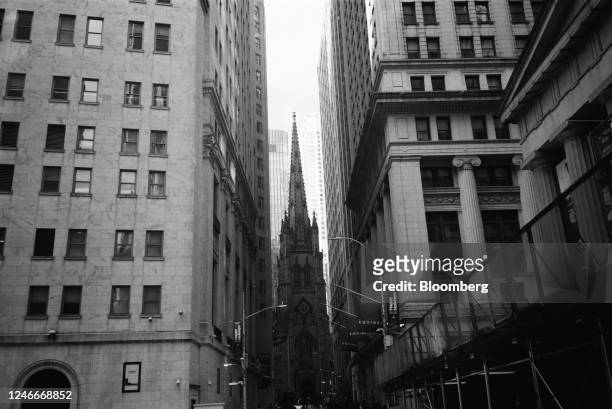 Trinity Church, center, near The New York Stock Exchange in New York, US, on Friday, Jan. 27, 2023. US stocks extended their drop as investors...
