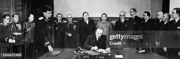 Soviet Foreign Minister Vyacheslav Molotov signs the Finno-Soviet Treaty between the Soviet Union and Finland on April 6, 1948 in Moscow. : Soviet...
