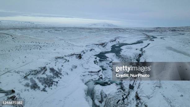 Drone view of snow covered Gullfoss Falls in Haukadalur Valley, Iceland, on January 23, 2023. -Gullfoss is one of Icelands most iconic waterfalls....