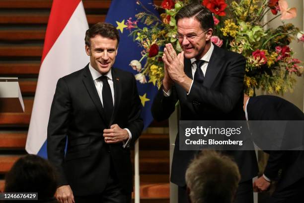 Emmanuel Macron, France's president, left, and Mark Rutte, Netherlands prime minister, depart a news conference following a meeting at the Binnenhof...