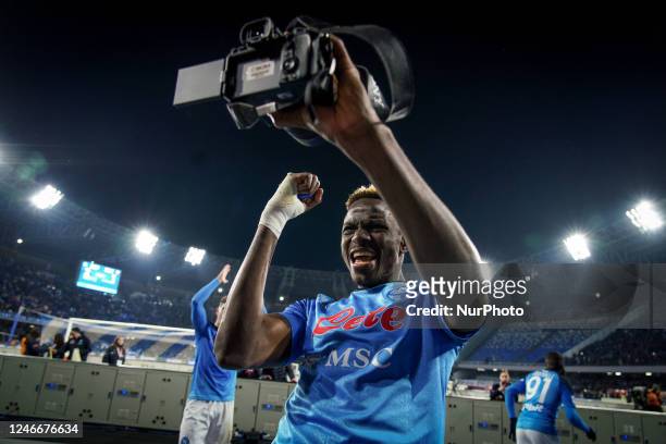 Victor Osimhen of SSC Napoli celebrates the victory taking pictures with a camera during the Serie A match between SSC Napoli and AS Roma at Stadio...