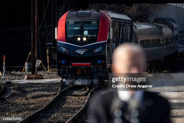 An Amtrak train is seen behind U.S. President Joe Biden as he speaks at the Baltimore and Potomac Tunnel North Portal on January 30, 2023 in...