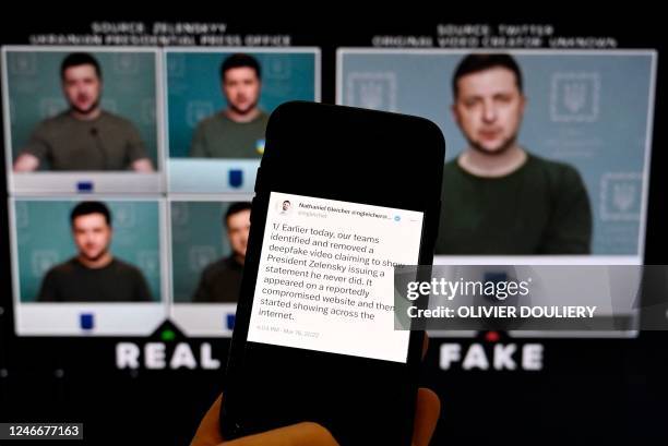 This illustration photo taken on January 30, 2023 shows a phone screen displaying a statement from the head of security policy at META with a fake...