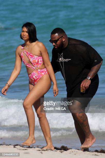 Chanel Iman and Davon Godchaux are seen on the beach on January 30, 2023 in Miami Beach, Florida.
