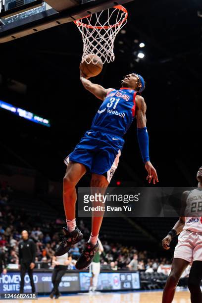 Alondes Williams of the Long Island Nets dunks the ball against the Wisconsin Herd on January 30, 2023 at Nassau Coliseum in Uniondale, New York....