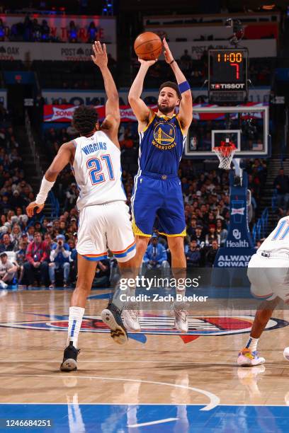Klay Thompson of the Golden State Warriors shoots a three point basket during the game on January 30, 2023 at Paycom Arena in Oklahoma City,...