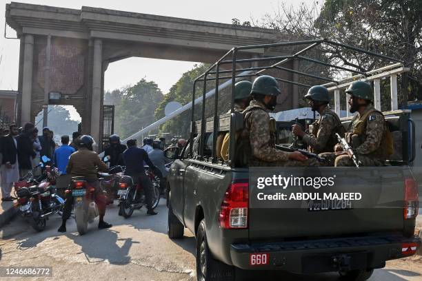 Pakistan's army soldiers patrol outside the police headquarters a day after a mosque blast in Peshawar on January 31, 2023. - At least 83 people died...