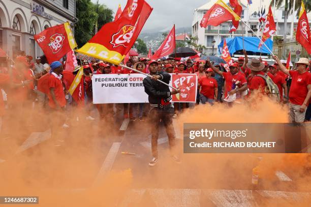 Protesters demonstrate with banners and flags on a second day of nationwide strikes and protests over the government's proposed pension reform, in...