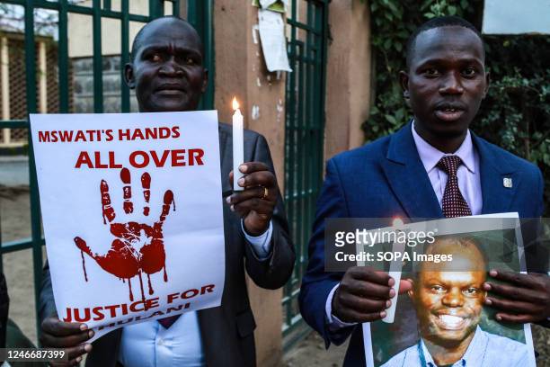 Activists hold candles and posters to pay tribute to the assassinated Eswatini, formerly Swaziland, Human Rights Lawyer Thulani Maseko in Nakuru...
