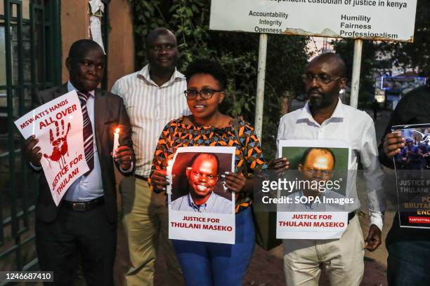 Activists hold candles and posters to pay tribute to the assassinated Eswatini, formerly Swaziland, Human Rights Lawyer Thulani Maseko in Nakuru...