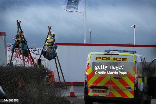 Protesters sit on top of tripods to block access to construction workers as police arrive to monitor the situation on January 31, 2023 in Full...