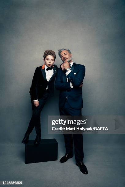 Actor Roman Griffin Davis and filmmaker, actor and comedian Taika Waititi are photographed at EE British Academy Film Awards on February 2, 2020 in...