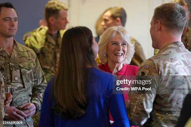 Camilla, Queen Consort and Colonel of the Grenadier Guards, meets members of the 1st Battalion as she visits Lille Barracks on January 31, 2023 in...