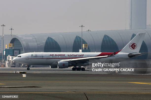 An Air Algerie Airbus A330-200 is pictured at the tarmac of Dubai International Airport in Dubai, on January 30, 2023.