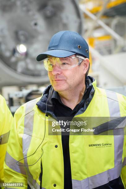 German Federal Economy and Climate Action Minister Robert Habeck is walking through an assembly hall while visiting the Siemens Gamesa wind turbine...