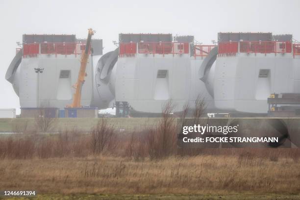 The nacelles of wind turbines are stored outside the Siemens Gamesa factory in Cuxhaven, Germany, on January 31, 2023. - In Cuxhaven, Siemens Gamesa...