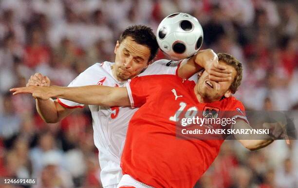 Polish midfielder Dariusz Dudka vies with Austrian midfielder Jurgen Saumel during their Euro 2008 Championships Group B football match Austria vs....