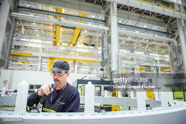 Worker is using a torque wrench while assembling hub parts of a wind turbine at the Siemens Gamesa wind turbine factory on January 31, 2023 in...